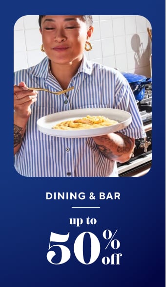 Dining & bar up to 50% off. Woman eating eggs on a white plate.