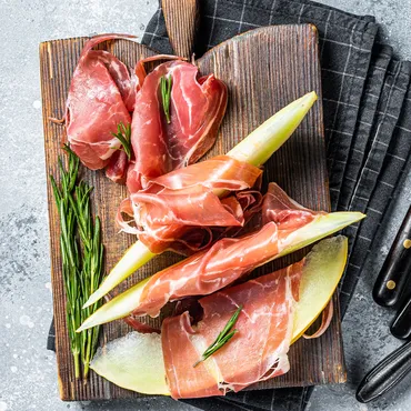 Marinated Prosciutto Wrapped Melon Slices